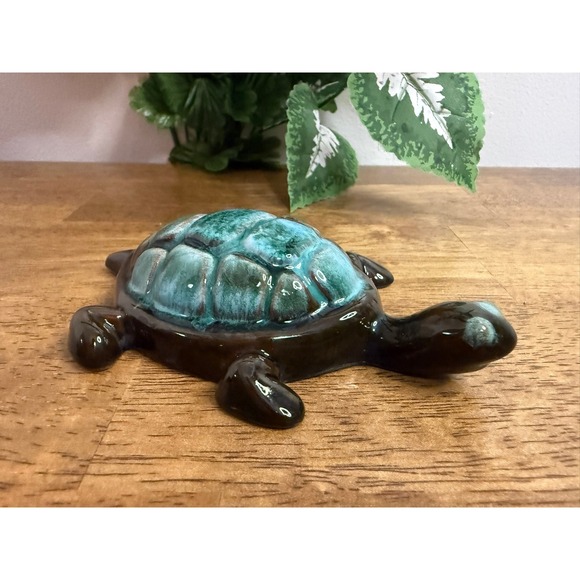A charming vintage Blue Mountain Pottery turtle figurine in the signature flowing teal and green glaze.